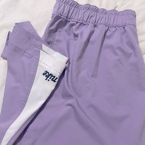 lilac nike track pants